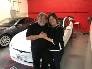 Steve Wozniak in front of his gifted Tesla